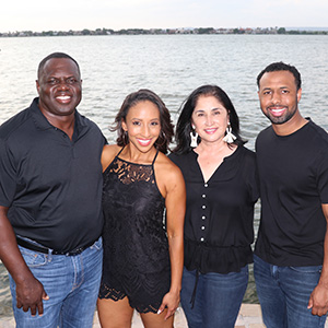 From left to right: Luther Huggins, Jessica Edison (daughter), Lucy Orozco-Huggins (spouse), Kenneth Huggins (son)