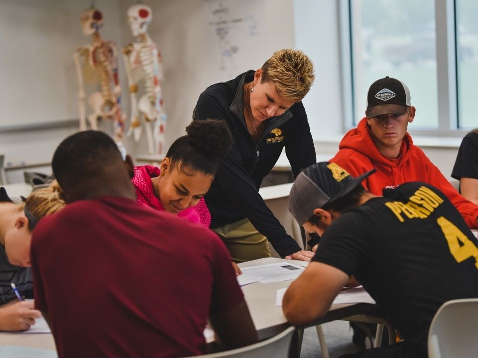 Faculty member working directly with students in the classroom