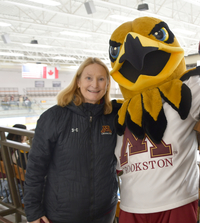 Chancellor with Regal at hockey game