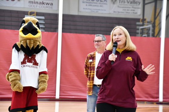 Mary Holz-Clause, Jonathon Holland and Regal the Eagle in Lysaker Gymnasium