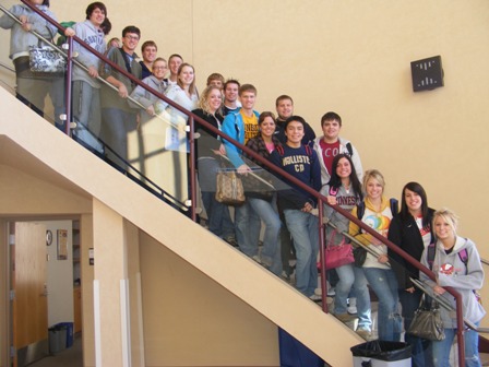 A group of high school students visiting UMN Crookston on the steps of Kiehle Auditorium