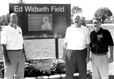 Ed Widseth pictured with Chancellor Don Sargeant next to field signage
