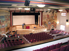 Kiehle Auditorium with murals on both sides of the stage