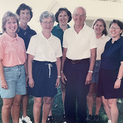 Searles is pictured with her late husband and five daughters