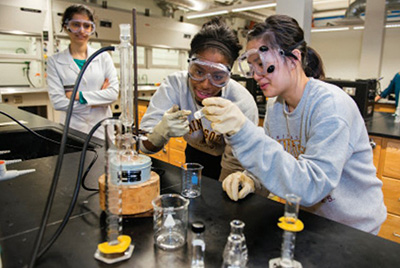 Three student in a chemistry lab