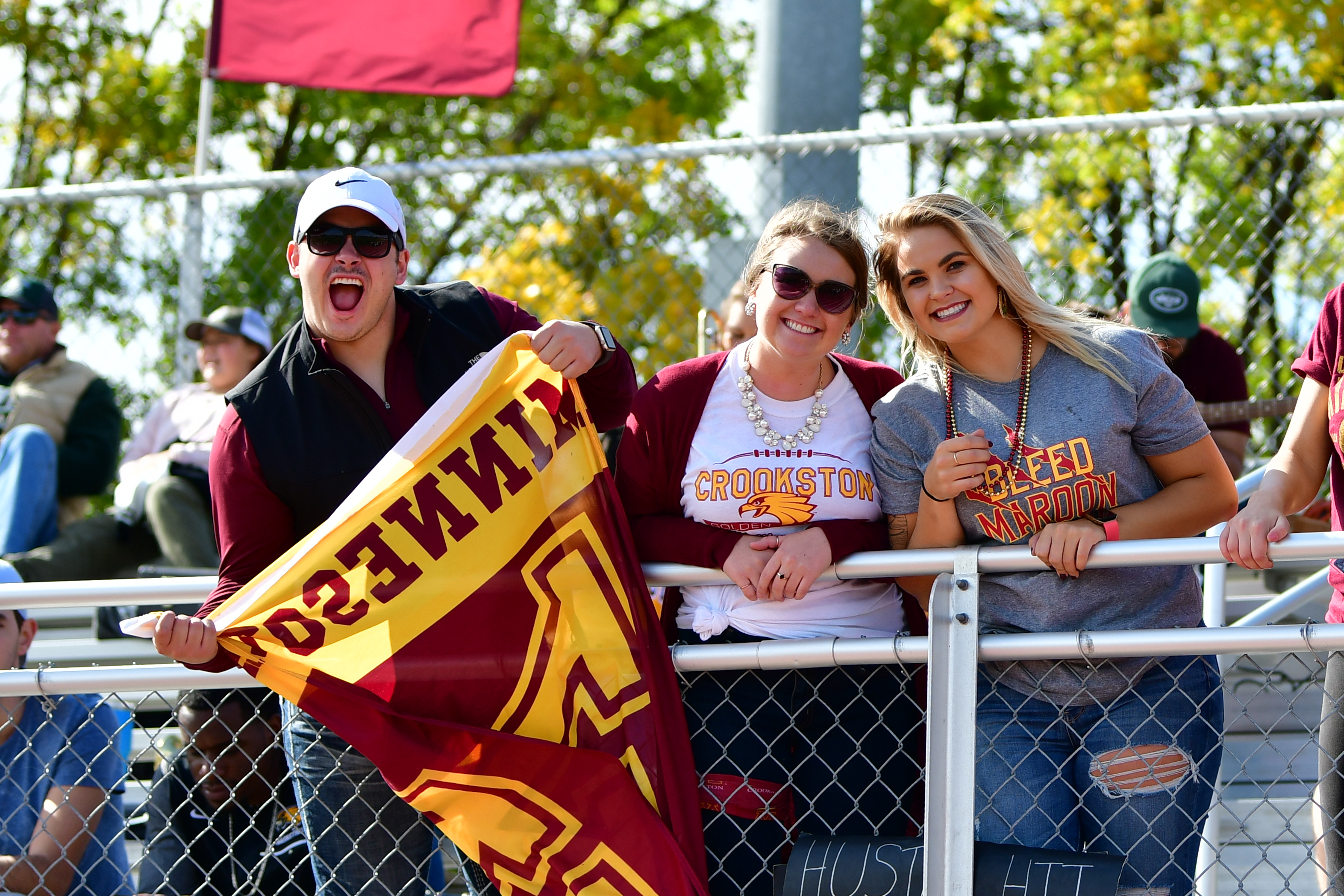 University of Minnesota fans cheering at sporting event.