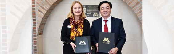UMC Chancellor Mary Holz-Clause and BKC President Hoang Van Phuc