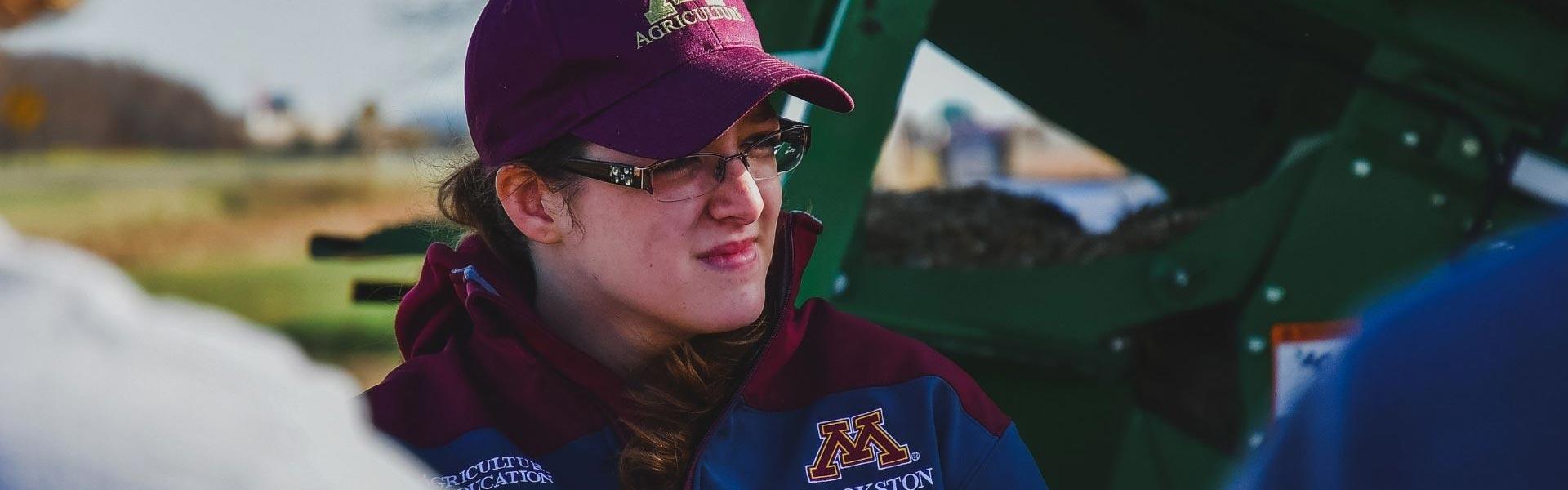 Ag student standing out in a grain field