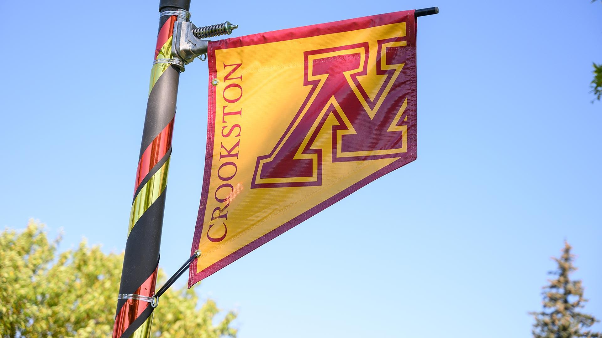 M Crookston logo flags on the Campus Mall