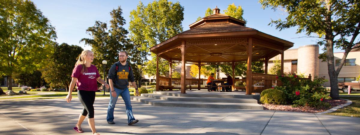 Students walking by Peterson Gazebo on a bright sunny day