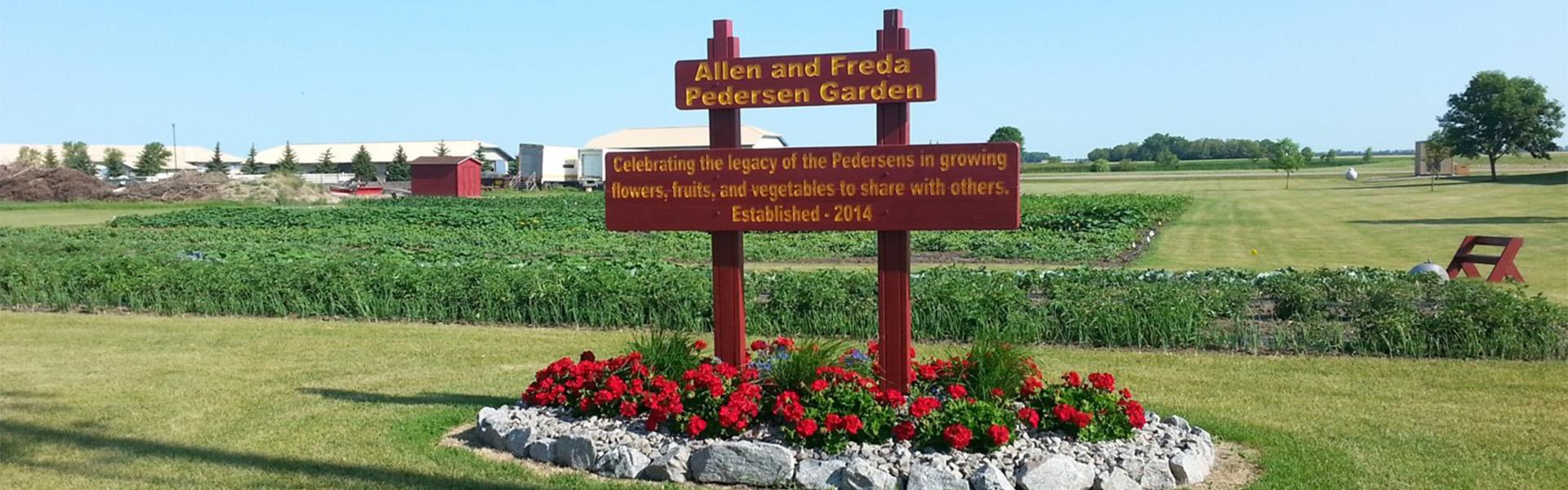 Allen and Freda Pedersen Garden sign and view of the garden in 2017