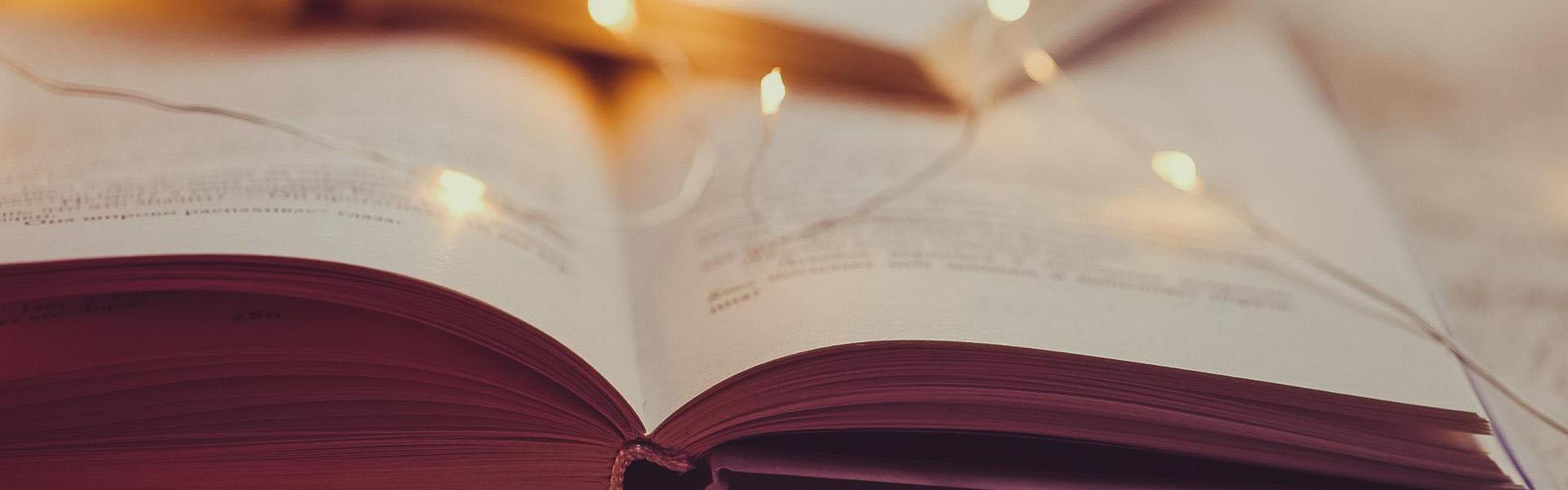 Photo of an open book laying on a table