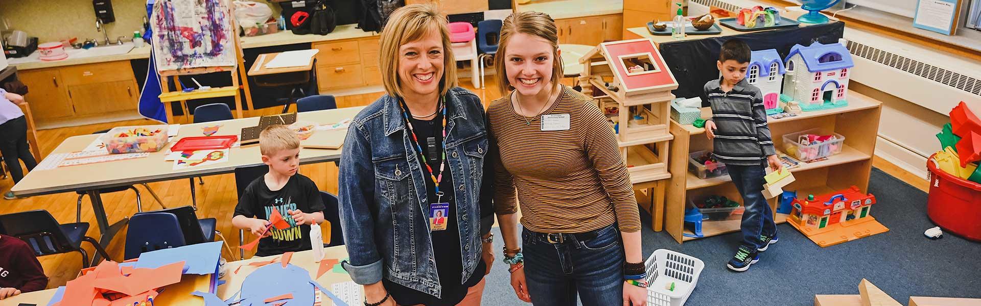 Karen and Kendra Brekken (mom and daughter), whom are both teachers, pictured in an early childhood classroom in a local school system