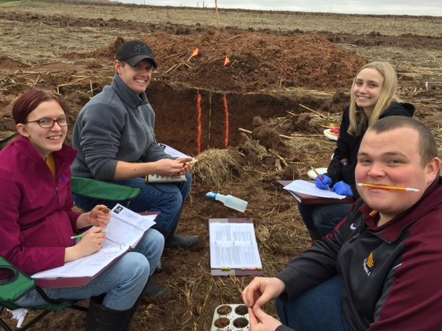 Students taking more soil samples