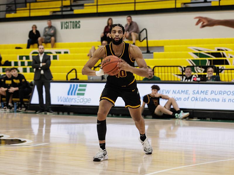 Golden Eagle men's basketball player looking to pass