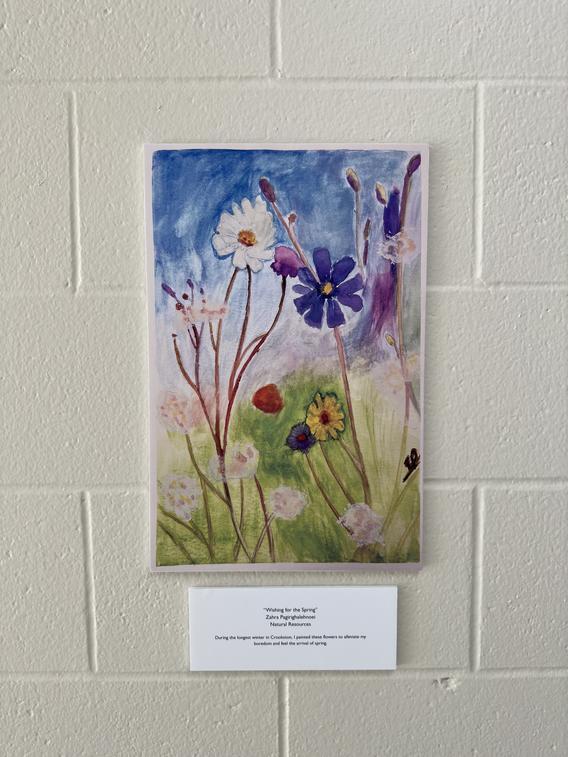 "Wishing for the Spring" water color painting of flowers and a blue sky made by a Natural Resources student