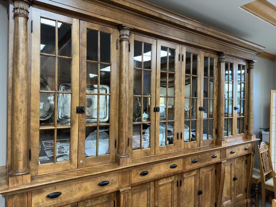 Wooden glass display cases with several artifacts from the Northwest School of Agriculture