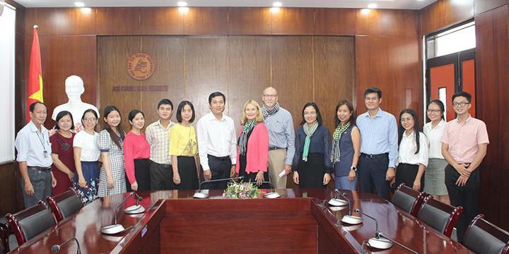 Mary Holz-Clause and Sok Leng Tan in Vietnam with administration