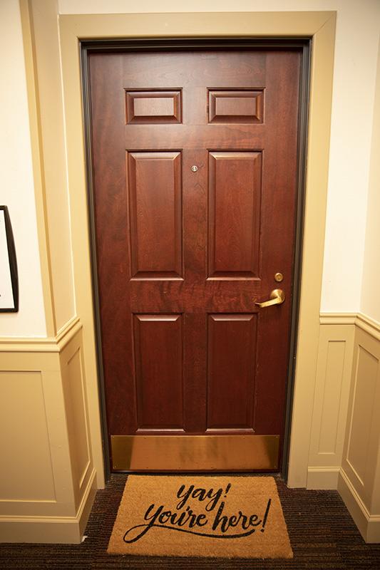 Heritage Hall room door with doormat