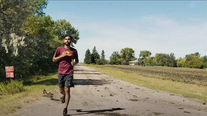 Manpreet Singh running on a rural road