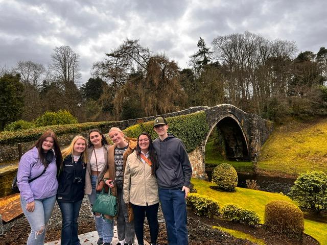 UMN Crookston Learning Abroad - Scotland Day 2, 2023: Students at ‘Auld Brig’, Brig o’ Doon is the original 15th-century cobblestone bridge , and it provided the setting for one of Burns’s most famous works.  Day 2