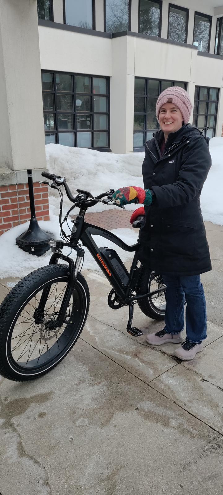 Associate Professor and Sustainability Coordinator Katy Chapman gets ready to ride an electric bike