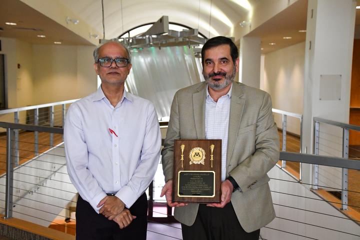 Distinguished Scholar Award: Ali Saeedi (pictured with Venu Mukku)