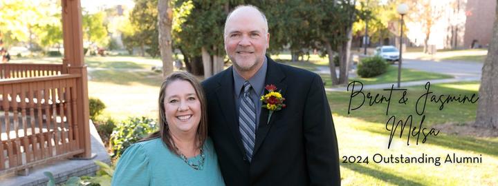 Brent and Jasmine Melsa 2024 Outstanding Alumni standing near Peterson Gazebo on a beautiful fall day