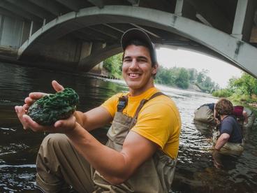 Student with a fresh water sponge