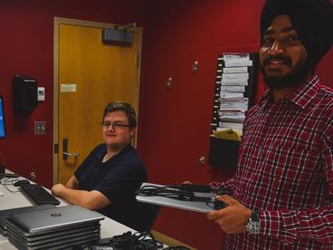 Two students working at the Computer Help Desk