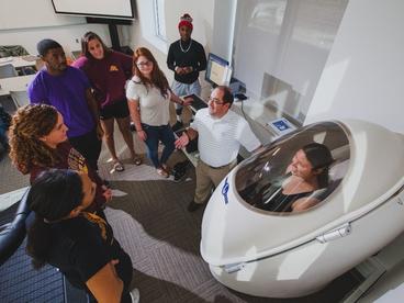 Exercise Science class looking at state of the art equipment