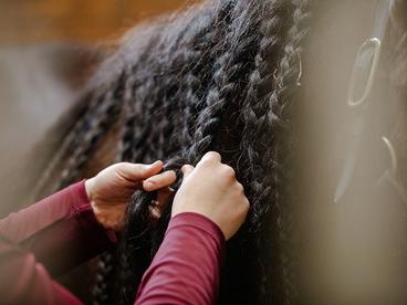 Braiding a horse's mane