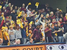 Golden Eagle fans cheering during a basketball game