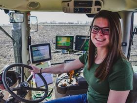 Student in a tractor cab with the latest technology